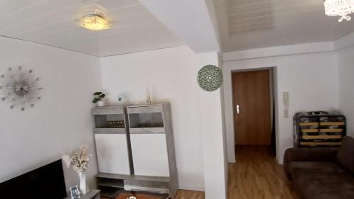 a living room with a couch and a table at White Sand Haven Guest House in Ebhausen