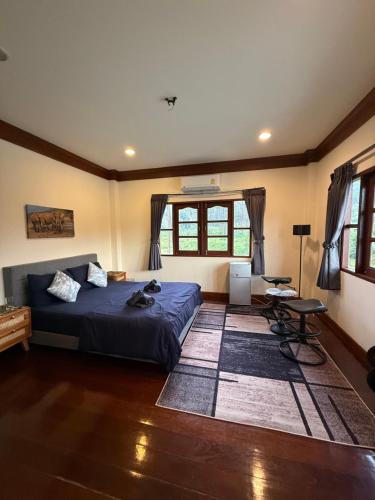 a bedroom with a bed and a table in a room at Sweet home in Bangrak Beach