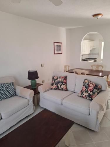 a living room with two couches and a table at Las Adelfas 2 in San Miguel de Abona