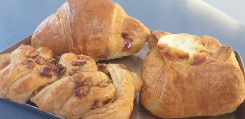 three pastries in a box on a table at Casa Puccia in Pachino