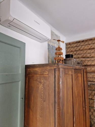 a kitchen with a wooden cabinet in a room at Hilltop view - 2 bedroom house with garden bbq - private parking - 12min to Uzupis anytime in Vilnius