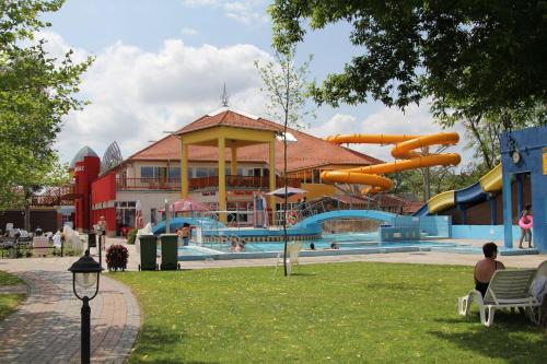 a large water park with a water slide at Holiday Apartman in Mórahalom