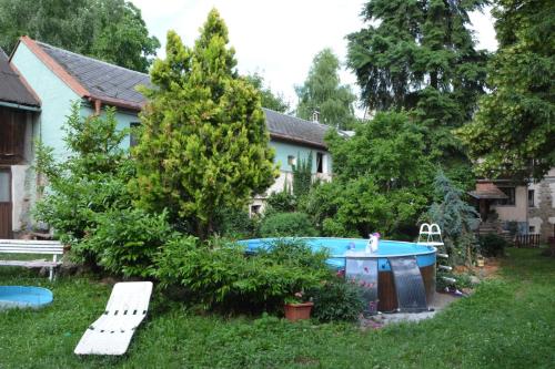 a backyard with a hot tub and a house at Statek Vojtěšín 