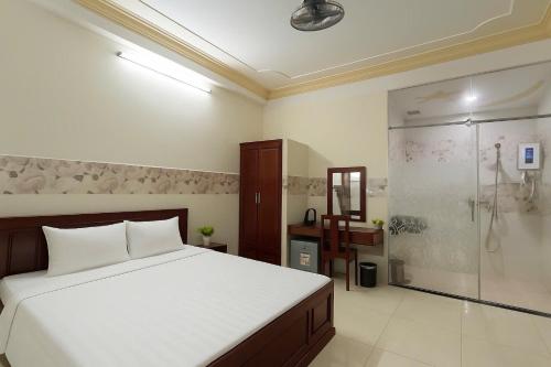 Katil atau katil-katil dalam bilik di Spring Hung Anh Hotel - Sân Bay TSN