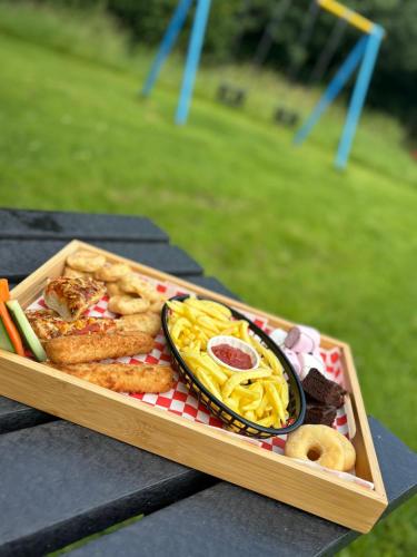 a tray of food on top of a table at The Greyhound Inn in Grizebeck