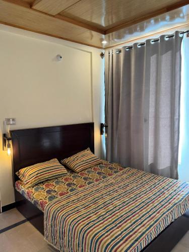 Katil atau katil-katil dalam bilik di Bhurban Smart Villas