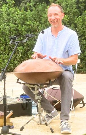a man sitting in a wheelbarrow next to a camera at Casa Oliva borgo del Benessere Olistico in Bargni