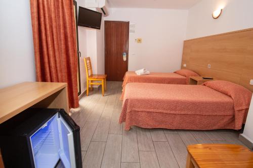 Katil atau katil-katil dalam bilik di Hostal Montaña