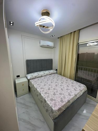 Giường trong phòng chung tại Two bedroom chalet - Porto golf - Al Alamein