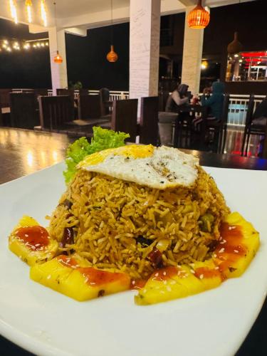 a plate of food on a white plate at Adams Peak Inn in Adams Peak