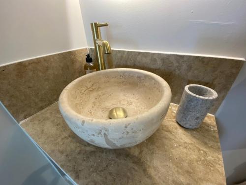 a bowl sink with a faucet on a counter at Cabanon Tihou bain nordique privatif piscine havre de paix in Le Beausset
