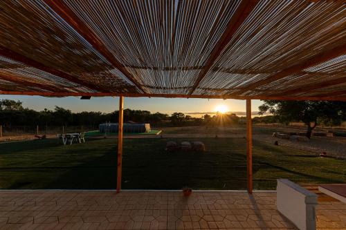 a view of the sunset from an outdoor patio at MdM - Monte dos Mestres in São Domingos