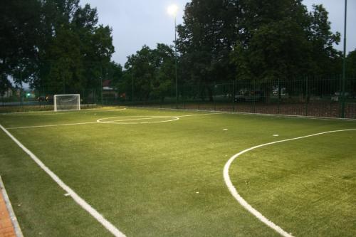 a soccer field with a net and a soccer ball at Villas and apartments Oaza in Sarajevo