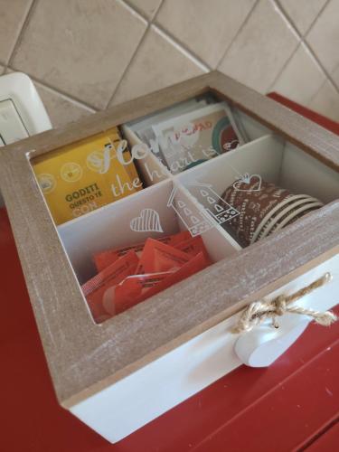 a box filled with different items on a table at Casa DiVa in Terni