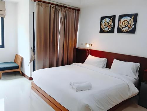 Ένα ή περισσότερα κρεβάτια σε δωμάτιο στο Yon INN Sukhumvit Soi 4 BTS Nana
