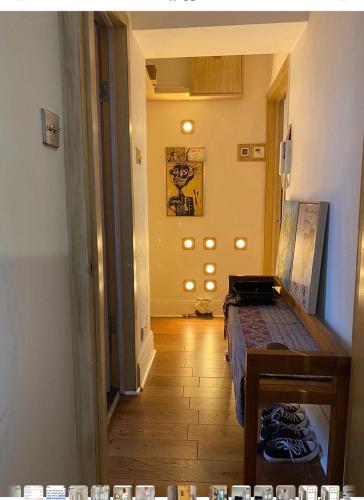 a hallway with a room with a bed and a table at 600sf 1 bedroom apartment in Moffat