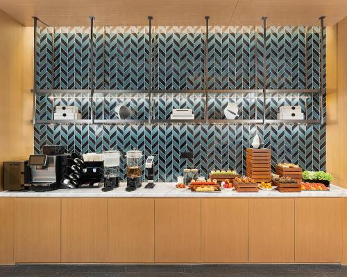 a kitchen with a buffet with food on it at Fairfield by Marriott Yining in Yining