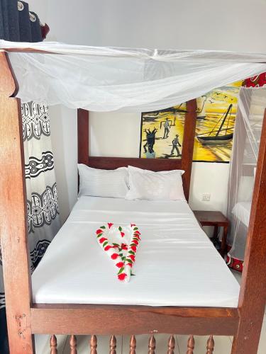 Katil atau katil-katil dalam bilik di Zanzi beach hotel