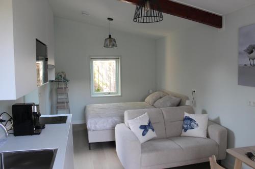Χώρος καθιστικού στο Vakantiestudio De Strandloper Zeeland