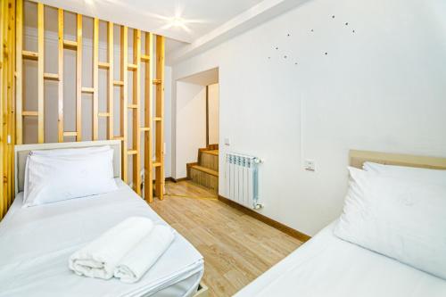 เตียงในห้องที่ Apartmet Kolorit