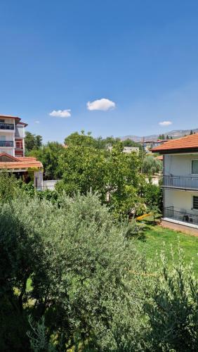 a view of a yard with trees and a house at Mery Inn in Pamukkale