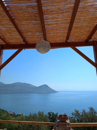 a view of the ocean from the porch of a house at Sofilia view house in Argilia