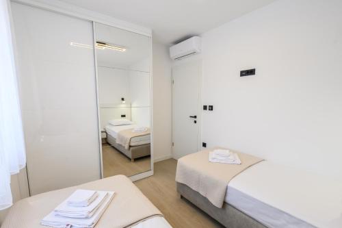 Postel nebo postele na pokoji v ubytování Maestral