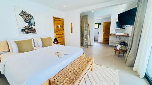 Voodi või voodid majutusasutuse Villa Chanalu toas