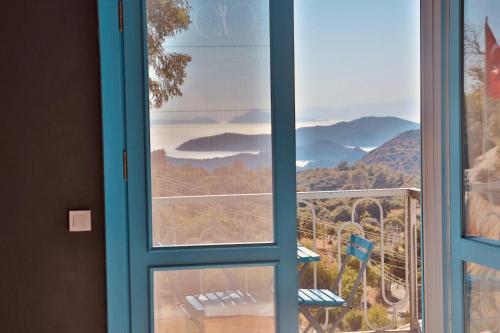 a window with a view of a mountain view at Villa Luna in Marmaris