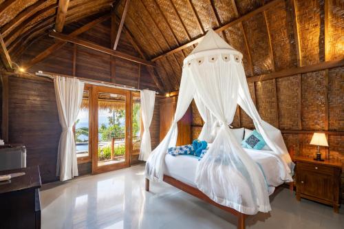Ένα ή περισσότερα κρεβάτια σε δωμάτιο στο Sundi Cottage Penida