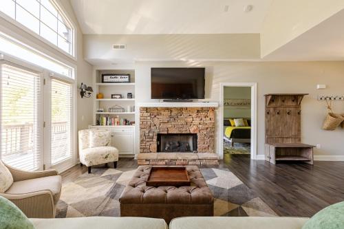 a living room with a fireplace and a tv at Majestic views of Mountains and Water- The Perch in Lake Lure