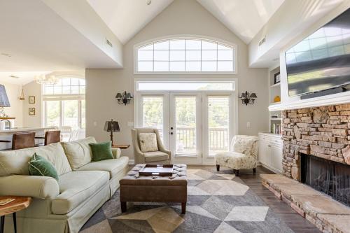 a living room with a couch and a fireplace at Majestic views of Mountains and Water- The Perch in Lake Lure