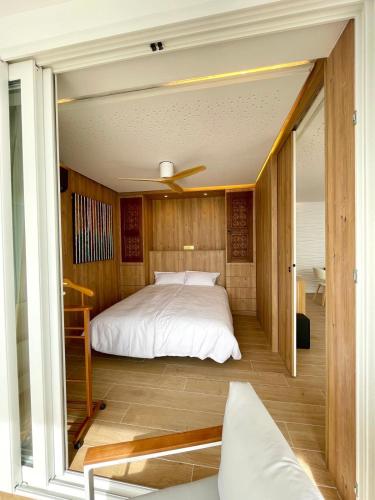 a bedroom with a bed and a large window at Wohnung Rio in Calpe