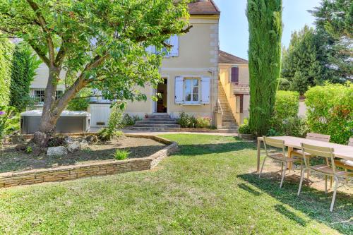 En have udenfor Appartement avec jardin - A 10 minutes de Disneyland