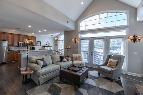 a living room with a couch and chairs and a kitchen at Majestic views of Mountains and Water- The Perch in Lake Lure