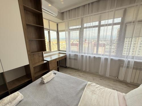 Ένα ή περισσότερα κρεβάτια σε δωμάτιο στο Urban Nest