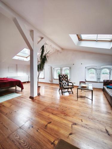 a large living room with a couch and a table at Herrenhaus Libnow in Murchin