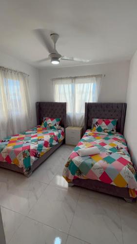 Postel nebo postele na pokoji v ubytování Ocean View Apartment in Santo Domingo Este