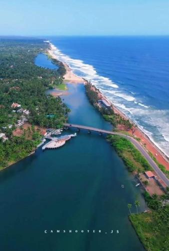 an aerial view of a bridge over a body of water at Tranquility Homestay in Varkala