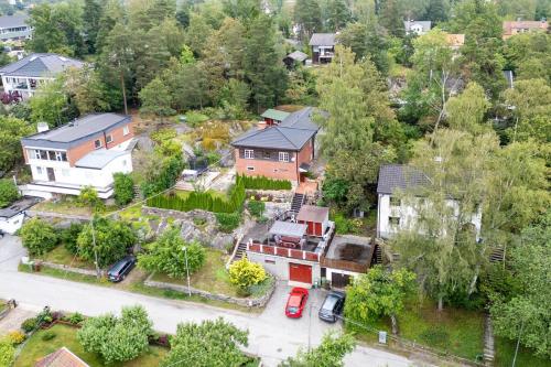 an aerial view of a house with a yard at Stylish Nordic Escape Near Stockholm in Huddinge