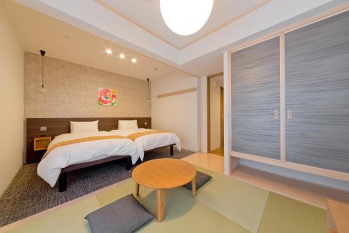 Rúm í herbergi á M's Inn Higashiyama