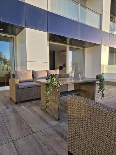 a lobby of a building with a couch and a table at Espinho Charm Stay in Espinho