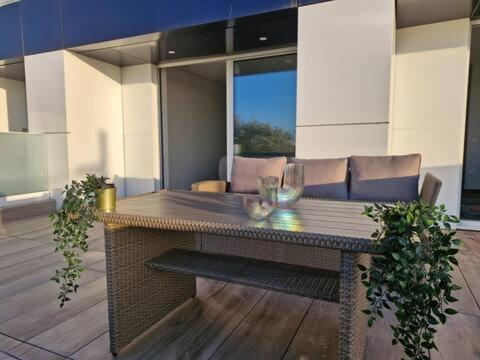 a table with two glasses on it in a room at Espinho Charm Stay in Espinho