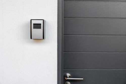 a black door with a switch on it at Chawal Stays Green Valley 1 in Nelspruit