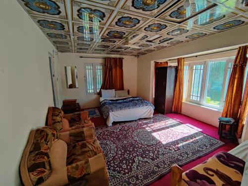 Postel nebo postele na pokoji v ubytování Buddha Rock Guest House