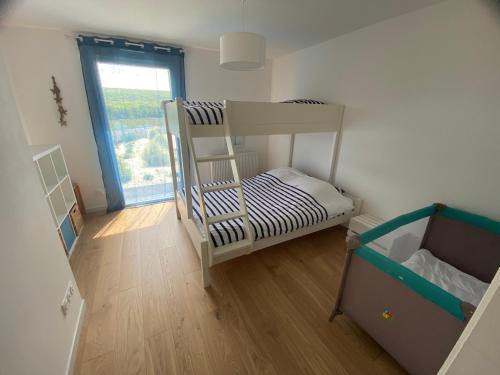 Postel nebo postele na pokoji v ubytování B&B Sangatte-Calais - Terrasse vue Mer - 2 min à pied de la plage