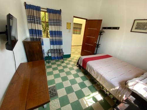 Ein Bett oder Betten in einem Zimmer der Unterkunft Hostal Mixteco Naba Nandoo