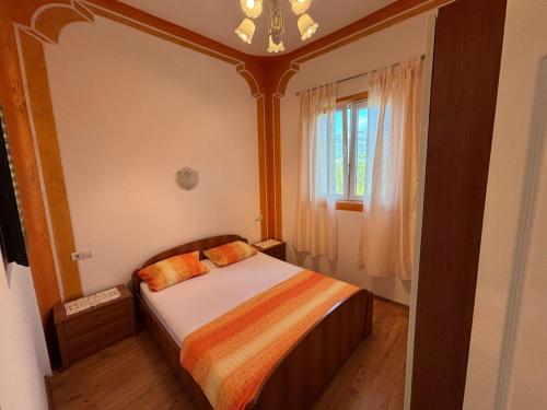 Postel nebo postele na pokoji v ubytování IVN Apartmani