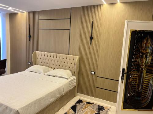 a bedroom with a bed and a harpsichord at Miracle Pyramids View Hotel in Giza