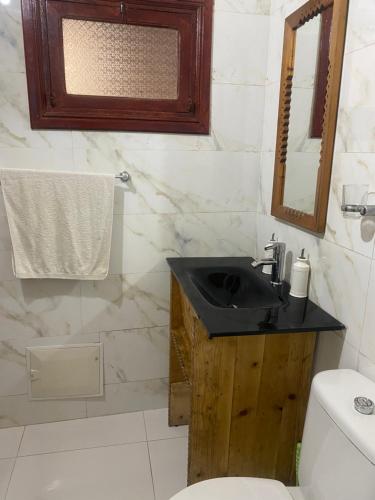 a bathroom with a sink and a toilet at RIAD Tamazouzt in Essaouira